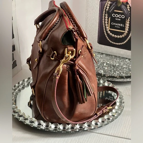 Dooney & Bourke florentina Italian Vacchetta leather handbag or crossbody